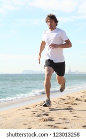 Man Running In The Beach. Diagonal View