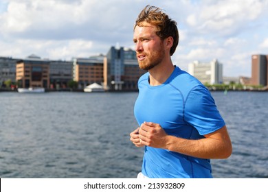 Man Running In Copenhagen City. Danish Male Runner Jogging In Bryggen, Copenhagen, Denmark.