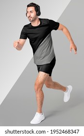 Man Running With Headphone And Black Sportswear Full Body