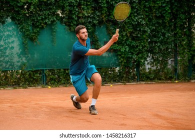 Man running to hit a ball. Professional tennis player holding a racket, showing agile footwork and concentration. - Powered by Shutterstock