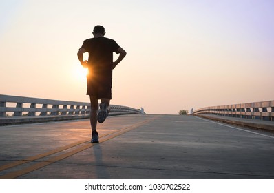 Man running jogging on bridge road. Health activities, Exercise by runner.
 - Shutterstock ID 1030702522