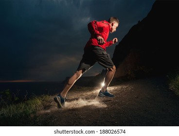 Man Running In The Mountains At Night