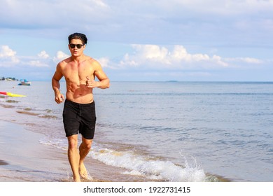 Man Running On The Beach