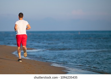 Man Running On Beach Sunset Stock Photo 1096235435 | Shutterstock