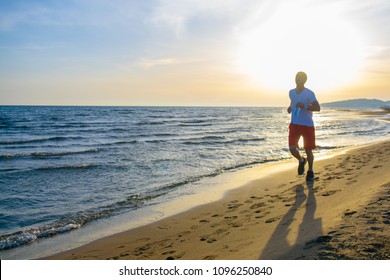 Man Running On Beach Sunset Stock Photo 1096250840 | Shutterstock