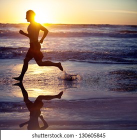 Man Running On The Beach At Sunset