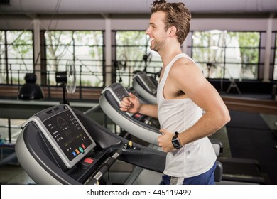 Man Running On Thread Mill At Gym