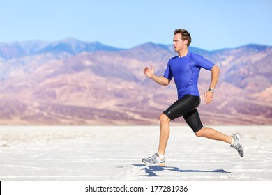 Man Running Outdoor Sprinting For Success. Male Fitness Runner Sport Athlete In Sprint At Great Speed In Beautiful Landscape In Desert.