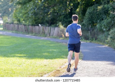 Man Running At The Park In New York City, USA, Daily Routine And Fitness Concept