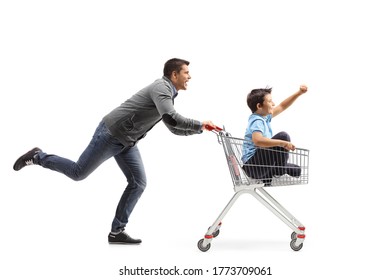 Man Running And Pushing A Boy Inside A Shopping Cart Isolated On White Background