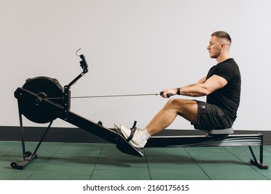 Man Running Rowing Excercise In The Gym