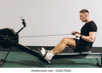 Man Running Rowing Excercise In The Gym