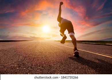 man running and sprinting on road with sunset background - Shutterstock ID 1841735266