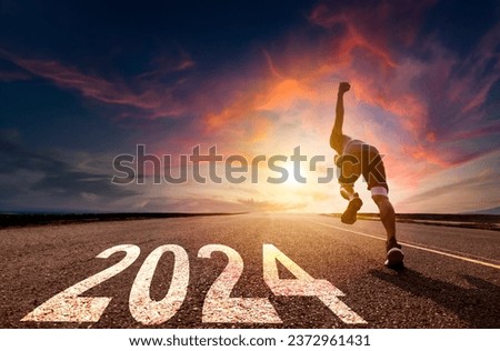 Man running and sprinting on road with 2024 success concept