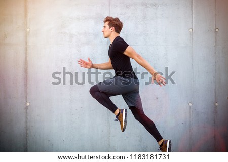 Similar – Happy man and jumping outdoors, warmup before jogging