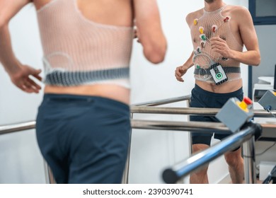 Man running while preforming a cardiovascular stress test in the hospital - Powered by Shutterstock