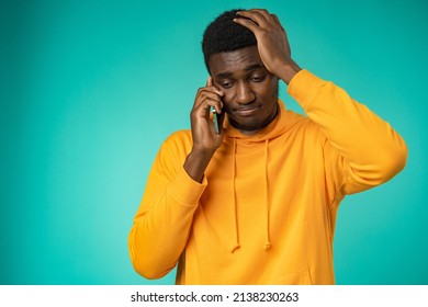 Man With A Sad Face Talking On The Phone In Studio