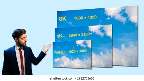 Man Salesman In Suit, Presenting Deferent Resolution Of TV From Full HD To 8K