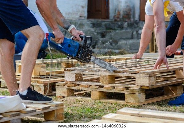 Man Sawing Wooden Pallet Chainsaw Making Stock Photo Edit Now