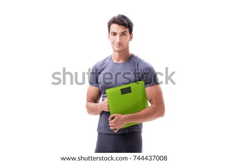 Man with scales in sports and health concept isolated on white