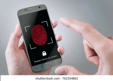 man is scanning fingerprint on smartphone, on gray backgrounds, unlock mobile phone - Powered by Shutterstock