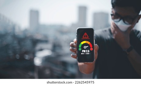 man scanning the weather on his mobile phone Ecological concept. Allergies. Headache.N95 PM 2.5 from air pollution and dust beyond safety standards. health care, environment, - Shutterstock ID 2262545975