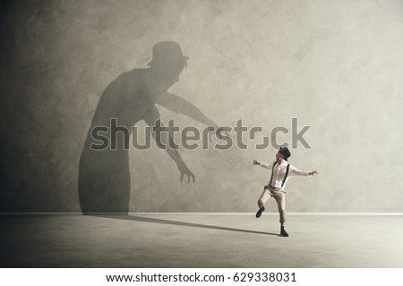 Man scared by his demon shadow 