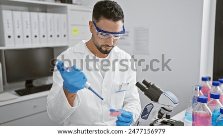 Similar – Image, Stock Photo Man scientist working at the laboratory. Selective focus.