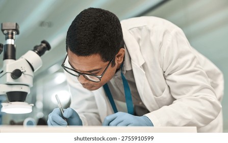 Man, scientist and writing notes in lab for research, medical report and experiment results. Male person, microscope and paperwork for record checklist, observation information and testing hypothesis