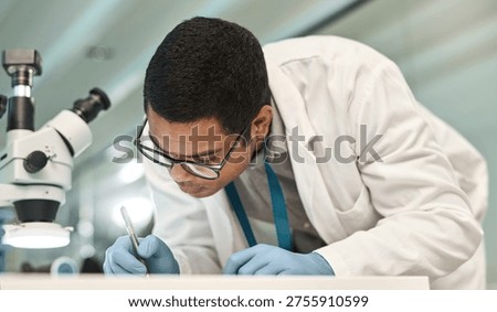 Man, scientist and writing notes in lab for research, medical report and experiment results. Male person, microscope and paperwork for record checklist, observation information and testing hypothesis
