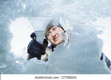 Man Scraping Snow And Ice From Car Window