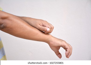 Man Scratching  Arm.