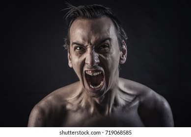 Man screaming with maddening and overwhelming rage - Shutterstock ID 719068585