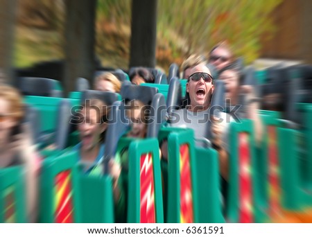 Man Screaming on Fast Roller Coaster with zoom blur