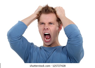 Man Screaming And Pulling His Hair