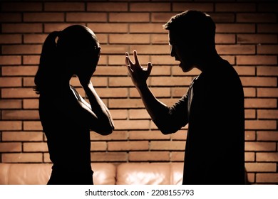 Man screaming verbal insults to woman. Domestic abuse and bad relationship concept.  - Powered by Shutterstock
