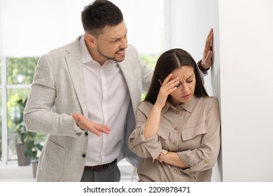 Man Screaming At Woman In Office. Toxic Work Environment