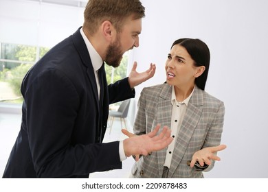 Man Screaming At Woman In Office. Toxic Work Environment