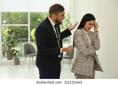 Man Screaming At Woman In Office. Toxic Work Environment