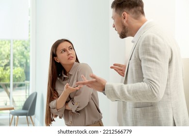 Man Screaming At Woman In Office. Toxic Work Environment