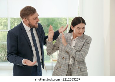 Man Screaming At Woman In Office. Toxic Work Environment