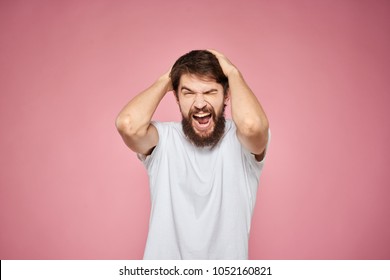  man screams holding hands on his head, emotions, logo                               - Shutterstock ID 1052160821