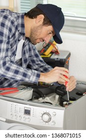 Man Is Screwing A Washer On White Background