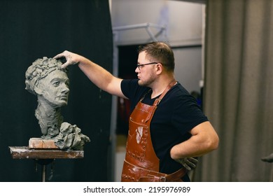 Man Sculptor Creates Sculpt Bust Clay Human Woman Sculpture. Statue Craft Creation Workshop. Small Business.