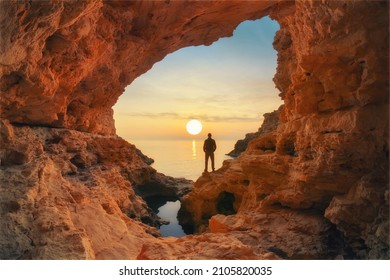 Man in sea grotto. Sea cave mainsail nature landsacpe. - Shutterstock ID 2105820035