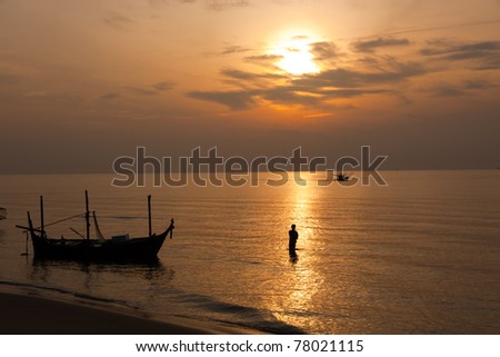 A man is in sea, sunset Thailand