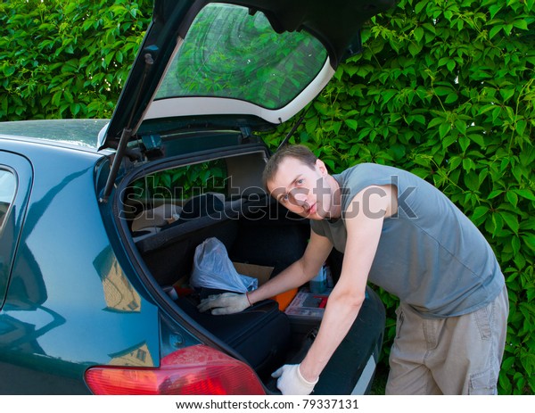 The man
searches for something in a luggage
carrier