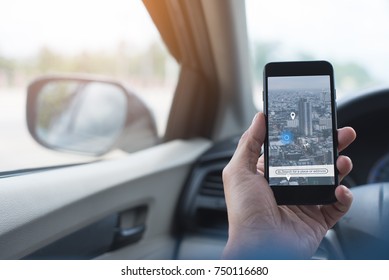 Man Searching Destination Direction Or Address On Gps Map Or Navigator Application Via  Mobile Smart Phone Inside A Car While Driving Car, Close Up