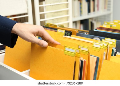 Man Searching For Documents In Archive