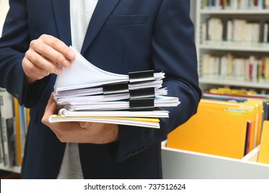 Man Searching For Documents In Archive